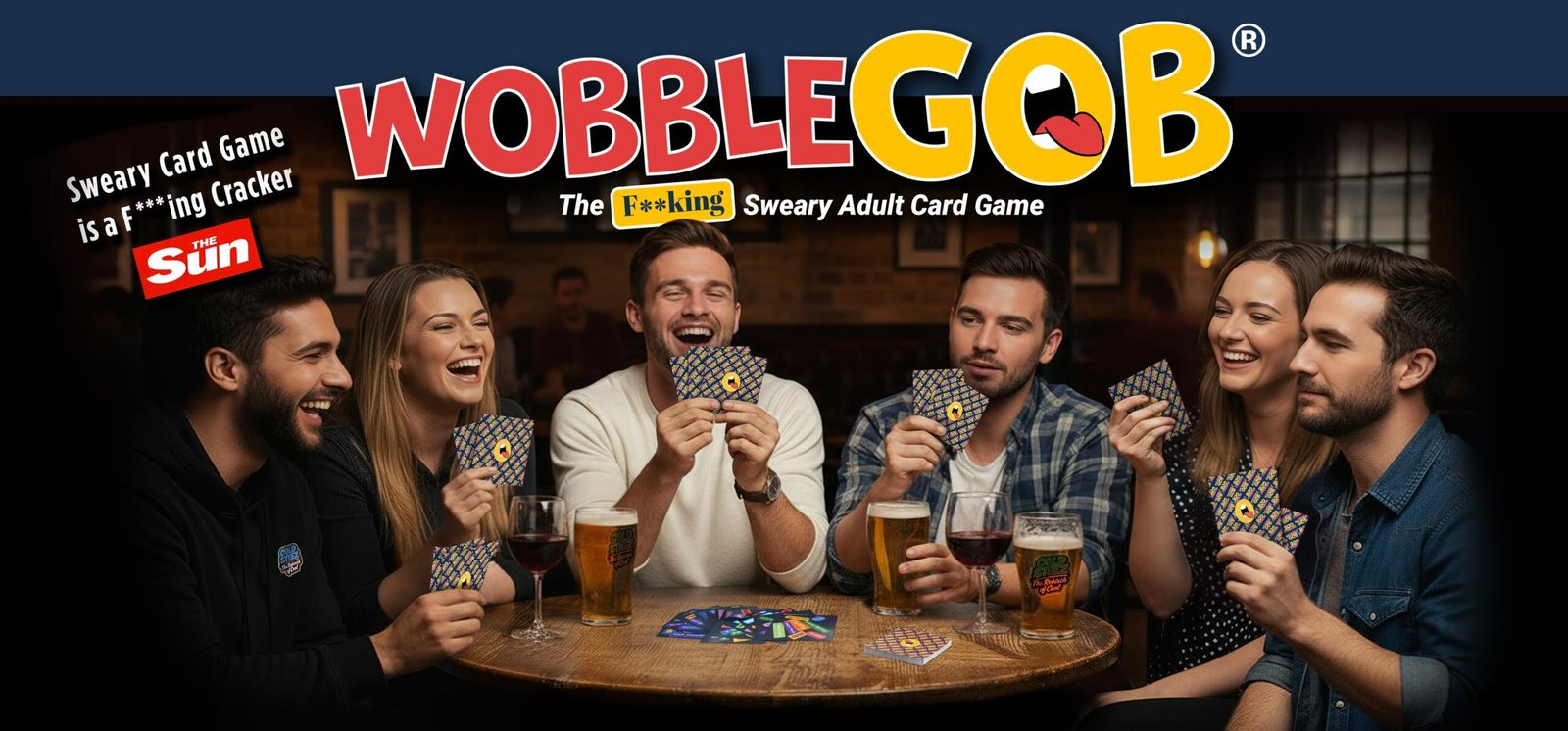people in the pub sat around a table playing WobbleGob laughing and having fun